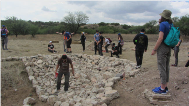 Volunteers Tending to Water Flow